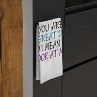 Printify eco-friendly dad tea towel with colorful text hanging on black kitchen cabinet