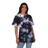 Printify eco-friendly embroidered shirt with tie-dye pattern and Never Stop Dreaming text worn by smiling woman