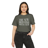 Printify eco-friendly fashion tee with The New Beginnings Social Club text worn by woman