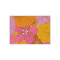Printify eco-friendly flower posters with vibrant pink and yellow floral design on a mustard background