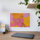 Printify eco-friendly flower posters with vibrant pink and yellow floral design on wall above desk
