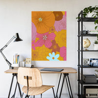Eco-friendly flower posters featuring colorful floral design displayed above a modern wooden desk setup
