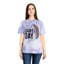 Woman wearing a Printify eco-friendly game day t-shirt with a purple tie-dye design and football graphic