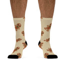 Printify eco-friendly ginger snaps socks featuring beige background with cute gingerbread man pattern and black heels and toes