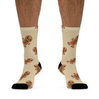Printify eco-friendly ginger snaps socks featuring beige background with cute gingerbread man pattern and black heels and toes