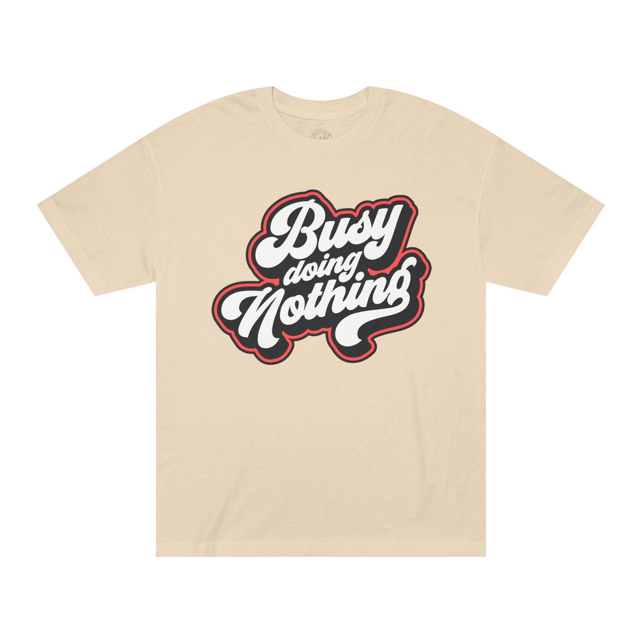 Printify beige eco-friendly graphic tee with Busy Doing Nothing bold white and black text design