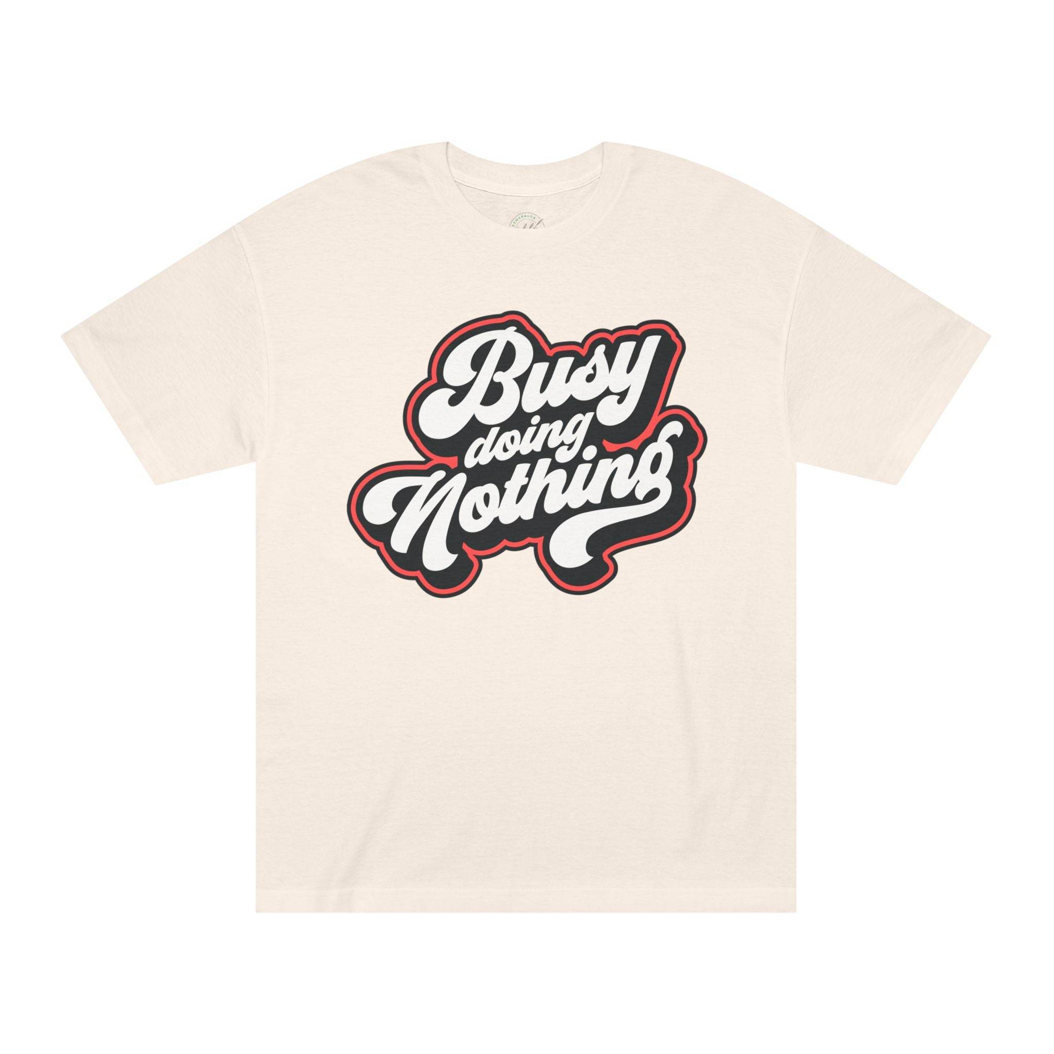 Printify beige eco-friendly graphic tee with Busy Doing Nothing text design in bold script