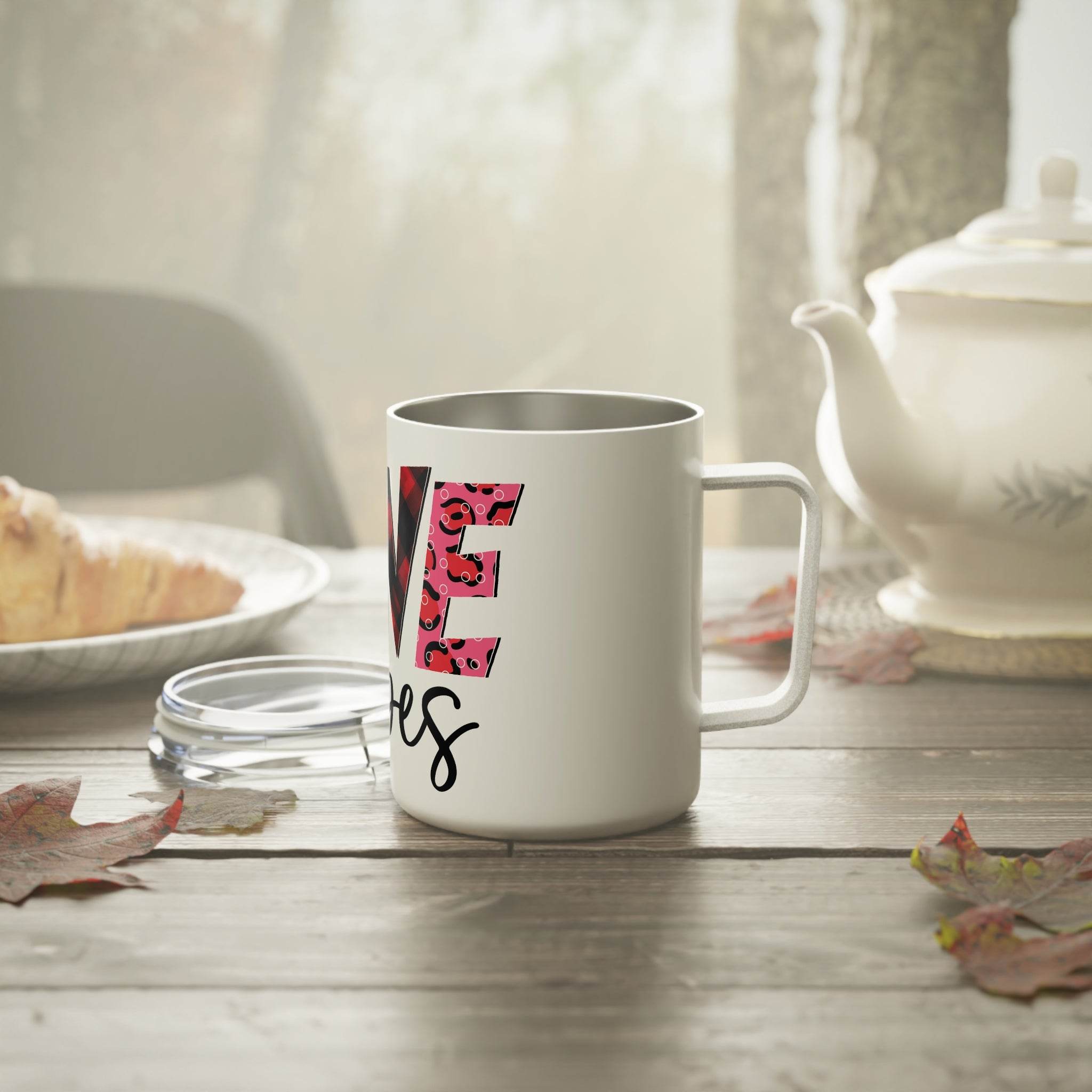 Printify white eco-friendly insulated coffee mug with floral design on wooden table near teapot and croissant