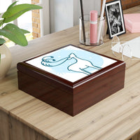 Elegant eco-friendly jewelry box with artistic design on a wooden surface in a bright workspace