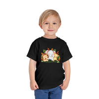 Printify black eco-friendly kids t-shirt with cute animal design worn by smiling toddler