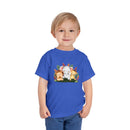 Printify eco-friendly kids t-shirt in blue with cute animal characters worn by a smiling young boy
