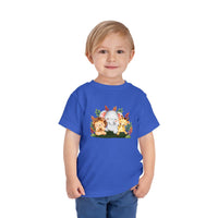 Printify eco-friendly kids t-shirt in blue with cute animal characters worn by a smiling young boy