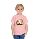 Eco-friendly kids t-shirt by Printify in pink with cute jungle animals graphic worn by child