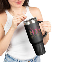 Printify eco-friendly mom travel mug in black with pink and gold MOM design held by woman in white tank top