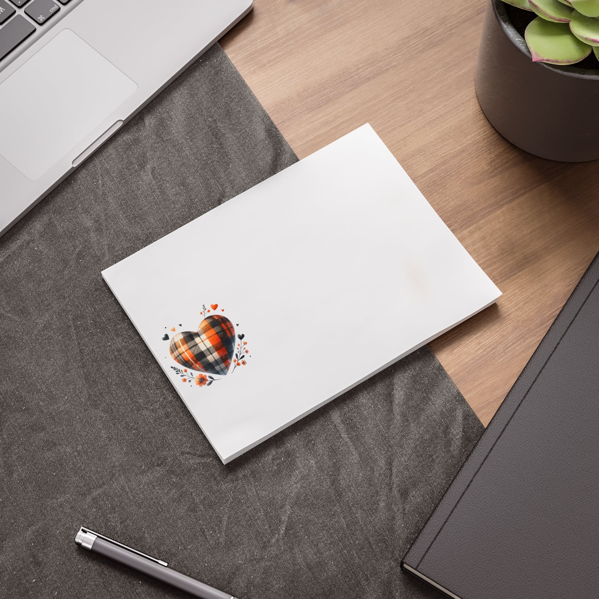 Printify eco-friendly note pads with heart design on desk next to laptop and pen