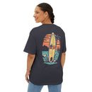 Printify eco-friendly oversized t-shirt in black with colorful surfboard and sunset graphic on back