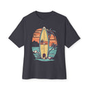 Printify eco-friendly oversized t-shirt with surfboard and tropical sunset graphic design