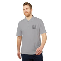 Gray eco-friendly polo shirt with Good Vibes Only print worn by male model from Printify