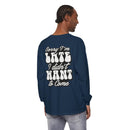 Man wearing a navy blue eco-friendly sarcastic long sleeve shirt with white bold text on the back