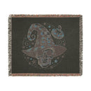 Printify eco-friendly skull blanket with a spooky skull wearing a checkered witch hat and pumpkin design