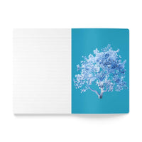 Open eco-friendly softcover journal by Printify with lined pages and blue tree cover design