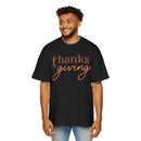 Printify eco-friendly Thanksgiving shirt men black t-shirt with brown and orange text design