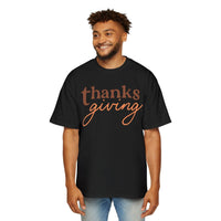 Printify eco-friendly Thanksgiving shirt men black t-shirt with brown and orange text design