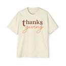 Printify eco-friendly Thanksgiving shirt men in cream with brown and orange Thanksgiving text