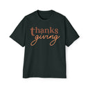 Printify black eco-friendly Thanksgiving shirt men with brown and orange thanksgiving text