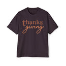 Printify eco-friendly Thanksgiving shirt men in dark color with brown and orange text design