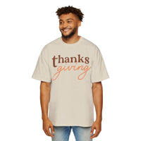 Men wearing Printify eco-friendly Thanksgiving shirt men in beige with Thanksgiving text design