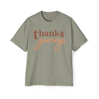 Printify eco-friendly Thanksgiving shirt men with brown and orange thanksgiving text on green t-shirt