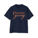 Navy Printify eco-friendly Thanksgiving shirt men with brown and orange thanksgiving text design