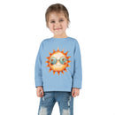 Printify eco-friendly toddler long sleeve shirt in light blue with sun graphic worn by smiling toddler