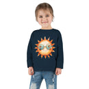 Printify eco-friendly toddler long sleeve shirt in navy blue with sun graphic worn by smiling child