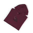 Maroon Printify eco friendly unisex hoodie with Stay Weird text design folded neatly