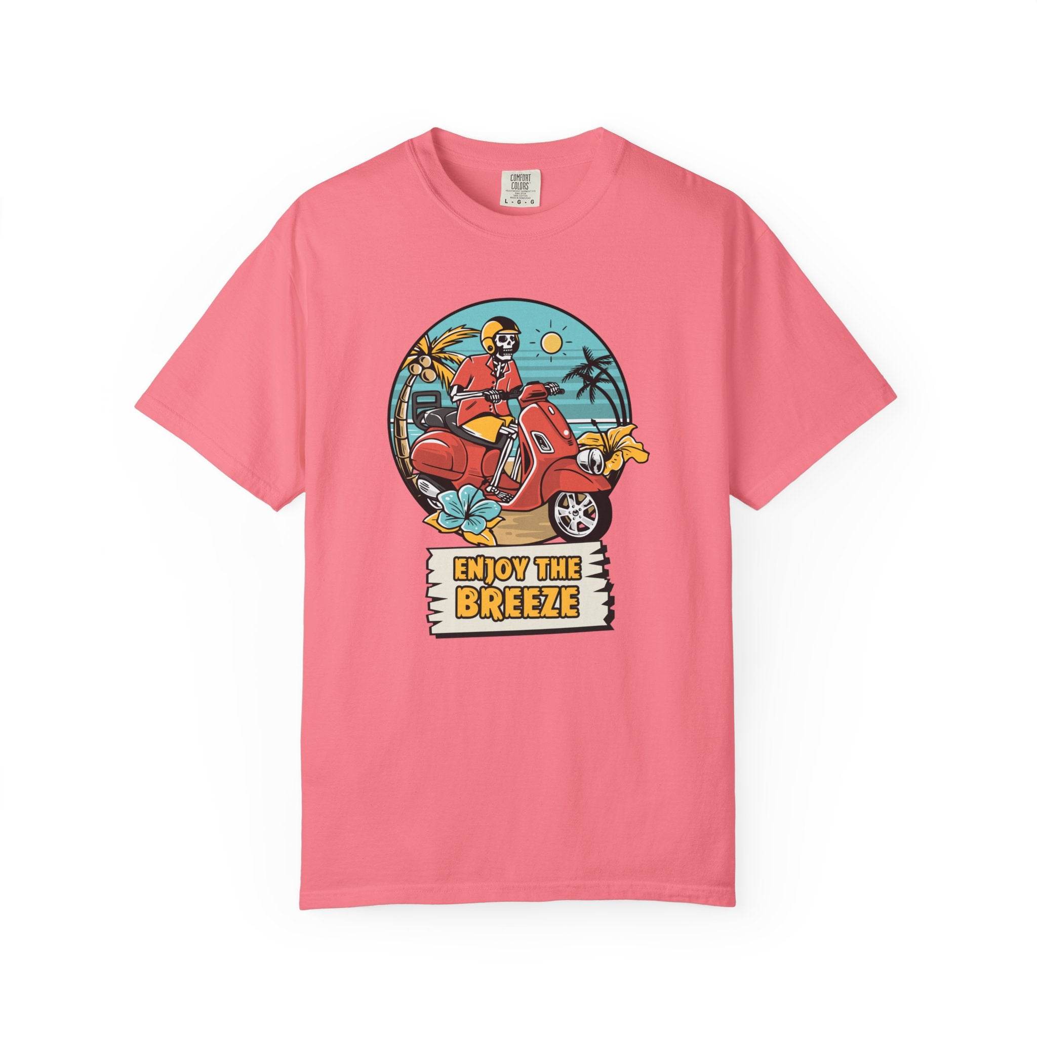 Printify pink eco-friendly unisex t-shirt with colorful scooter and beach graphic saying Enjoy the Breeze
