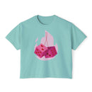 Printify eco-friendly women boxy tee in light blue with pink flaming dice graphic on front