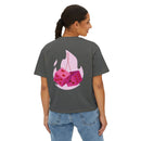 Printify eco-friendly women boxy tee in dark gray with pink dice graphic on the back worn by a woman