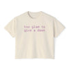Printify eco-friendly women's graphic tee in cream with too glam to give a dawn purple text