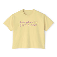 Printify eco-friendly women's graphic tee in light yellow with purple text saying too glam to give a dawn