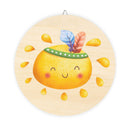 Round eco-friendly wood signs with smiling yellow fruit and colorful feathers for home decor