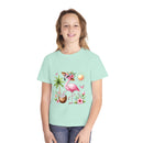 Printify eco-friendly youth t-shirt with a colorful flamingo and tropical design on light green fabric