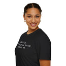 Printify eco-friendly playful quote t-shirt on smiling woman black crew neck with white printed text and short sleeves