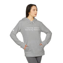 Printify gray eco-friendly unisex fleece hoodie worn by model with kangaroo pocket and text raising babies building business