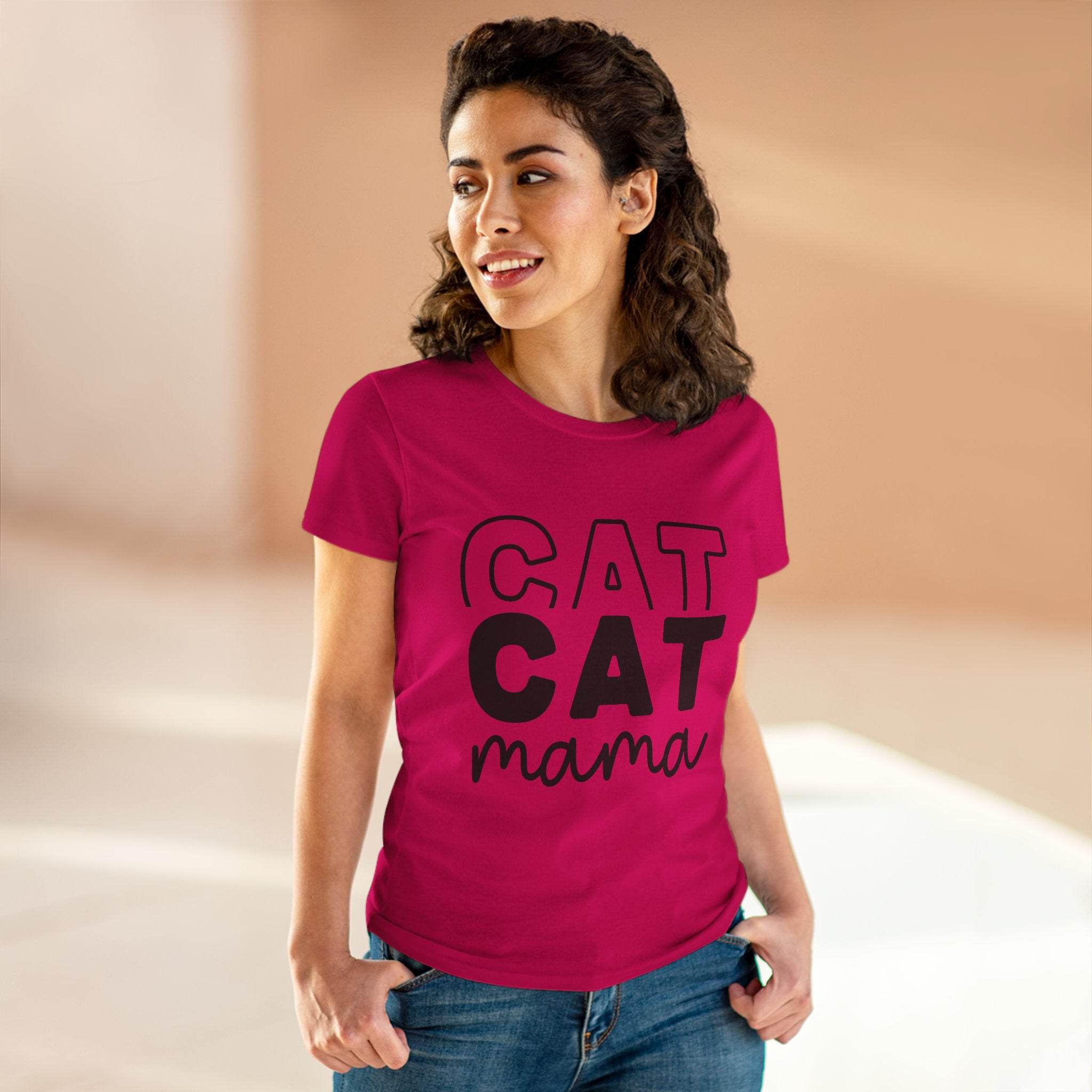 Woman wearing magenta Printify eco-friendly cat mom shirt with bold CAT CAT mama design and jeans smiling