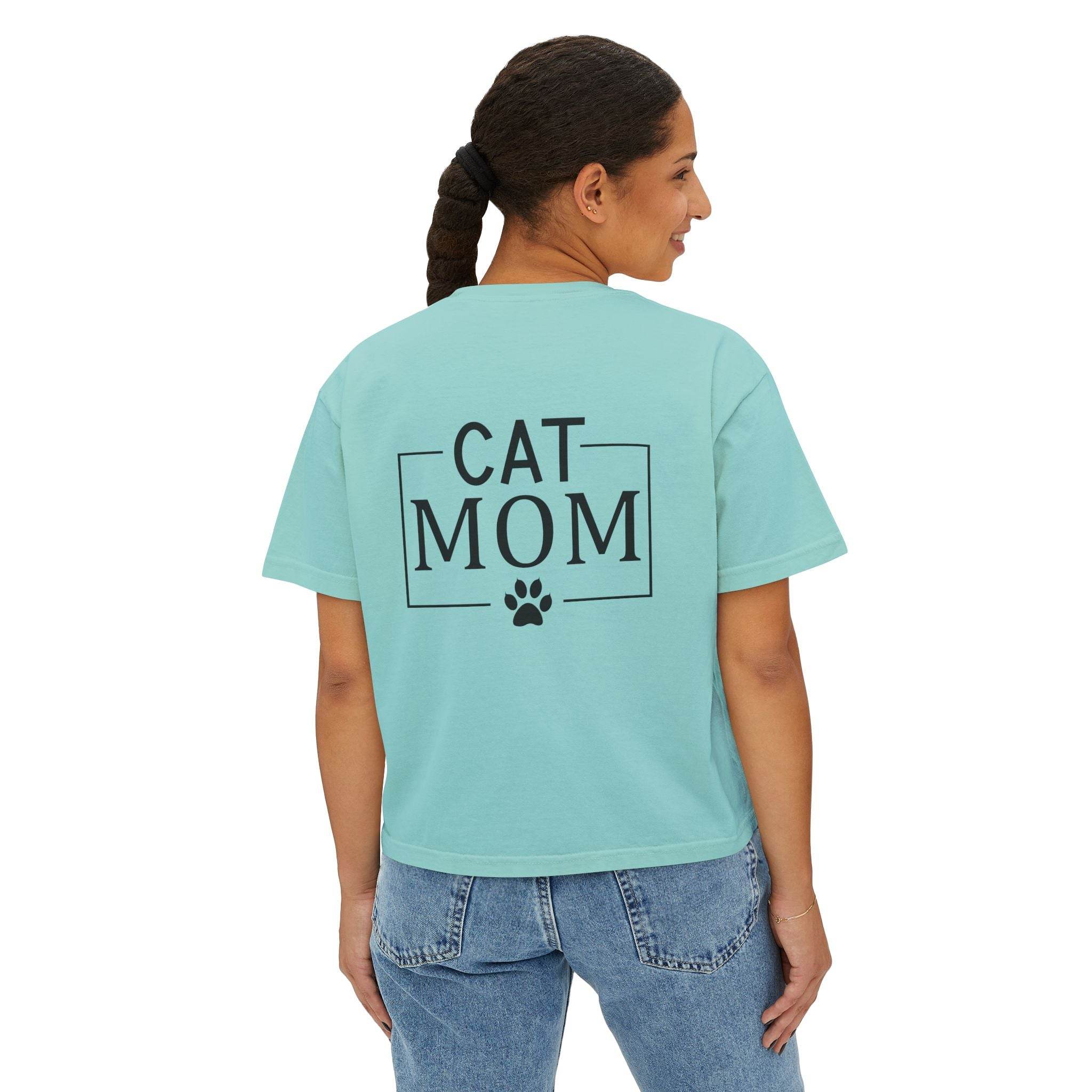 Printify model wearing aqua cropped eco-friendly cat mom shirt with bold CAT MOM text and paw print on back