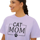 Printify eco-friendly cat mom shirt light lavender tee with black CAT MOM text and paw graphic worn by smiling model