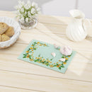 Floral eco-friendly cutting board with yellow flower design on light blue background by Printify