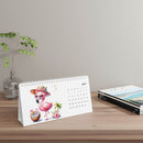 Printify eco-friendly desk calendar 2025 with tropical flamingo design for May on wooden desk
